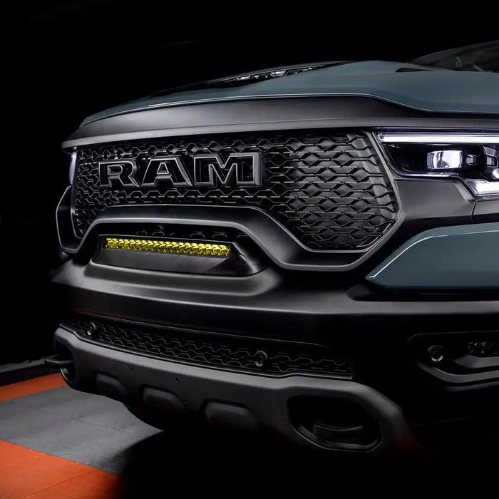 Front end of a RAM TRX with Front Bumper Flush LED Light Bar System installed with yellow LEDs
