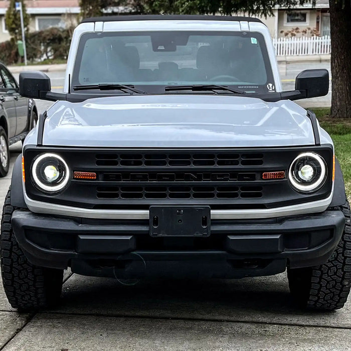 Front view of a white Ford Bronco with Oculus Headlights installed.