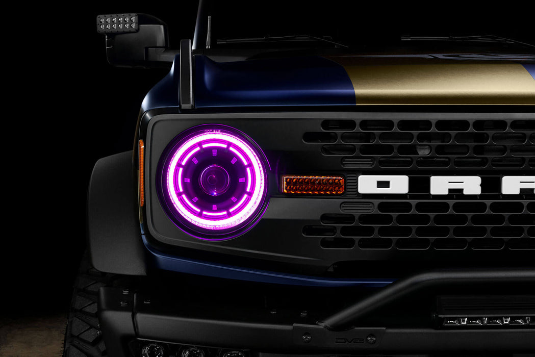 Close up view of Oculus™ ColorSHIFT® Bi-LED Projector Headlights installed on Ford Bronco with pink LEDs