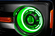 Extreme close up view of Oculus™ ColorSHIFT® Bi-LED Projector Headlights installed with green LEDs
