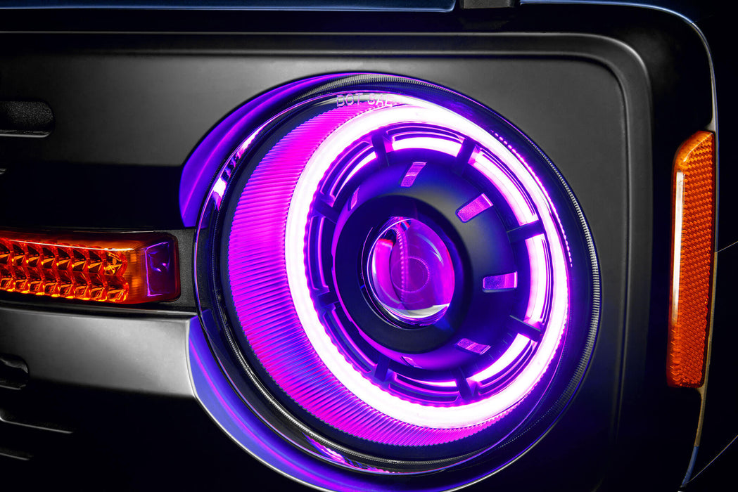 Extreme close up view of Oculus™ ColorSHIFT® Bi-LED Projector Headlights installed with pink LEDs