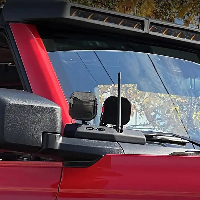 Close-up of a Integrated Windshield Roof LED Light Bar System installed on a red Ford Bronco.