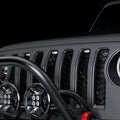 Close-up of a Universal Pre-Runner Style LED Grill Light Kit with clear lens installed on Jeep Wrangler.
