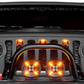Front grill of a Jeep Wrangler with Universal Pre-Runner Style LED Grill Light Kit installed and amber LEDs turned on.