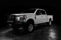 Three quarters view of a white Ford SuperDuty with LED Off-Road Side Mirrors installed.