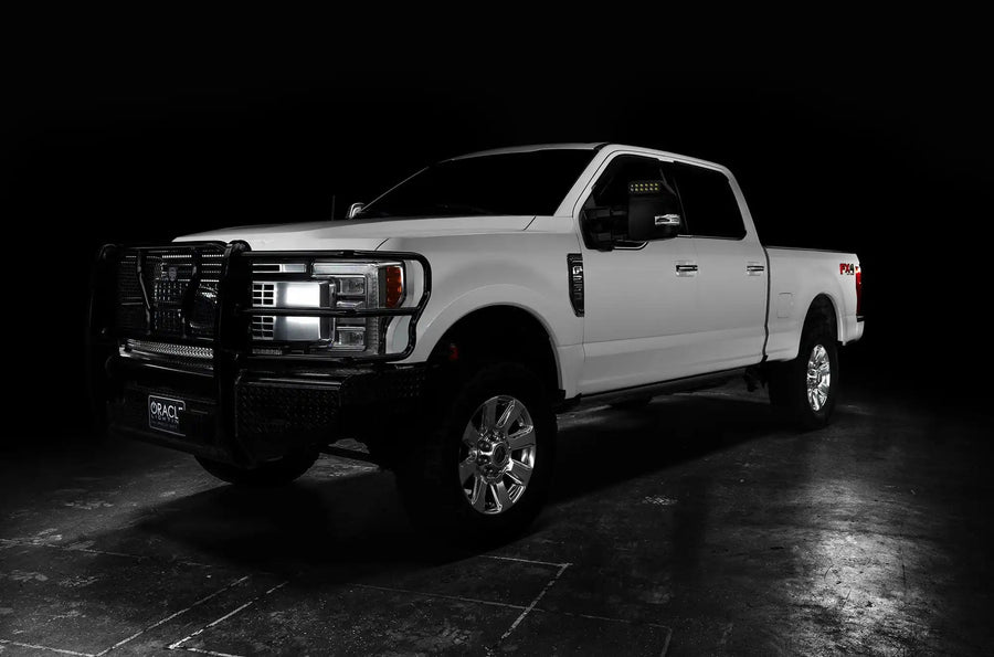 Three quarters view of a white Ford SuperDuty with LED Off-Road Side Mirrors installed.