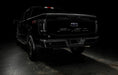 Rear three quarters view of black Ford F-150 with Tinted Flush Style LED Tail Lights installed