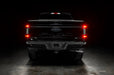Straight rear view of black Ford F-150 with Flush Style LED Tail Lights installed and running lights on