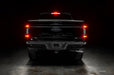 Straight rear view of black Ford F-150 with Flush Style LED Tail Lights installed and brake lights on