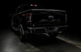 Rear three quarters view of black Ford F-150 with Flush Style LED Tail Lights installed