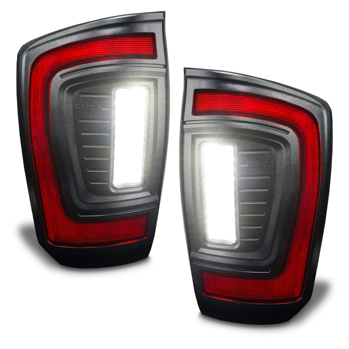 Angled view of Flush Style LED Tail Lights for 2016-2023 Gen 3 Toyota Tacoma with reverse lights on
