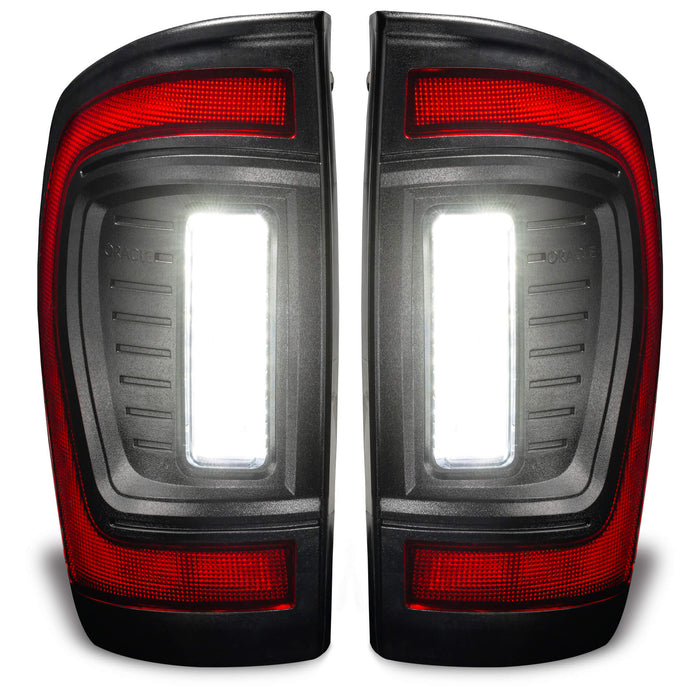 Front view of Flush Style LED Tail Lights for 2016-2023 Gen 3 Toyota Tacoma with reverse lights on