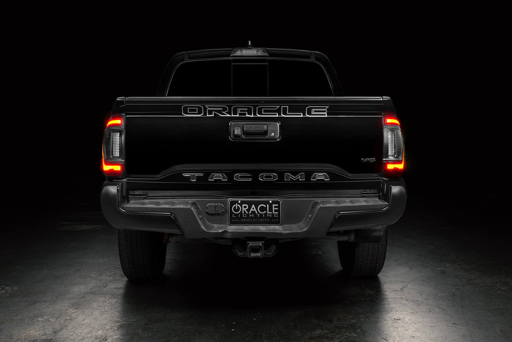Straight rear view of black Toyota Tacoma with Flush Style LED Tail Lights installed and brake lights on