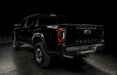 Rear three quarters view of black Toyota Tacoma focused on the Flush Style LED Tail Lights installed