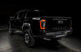 Rear view of black Toyota Tacoma with Flush Style LED Tail Lights installed and running lights on