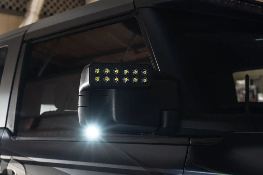 Close-up of a LED Side Mirror installed on a Ford Bronco with Puddle Light upgrade