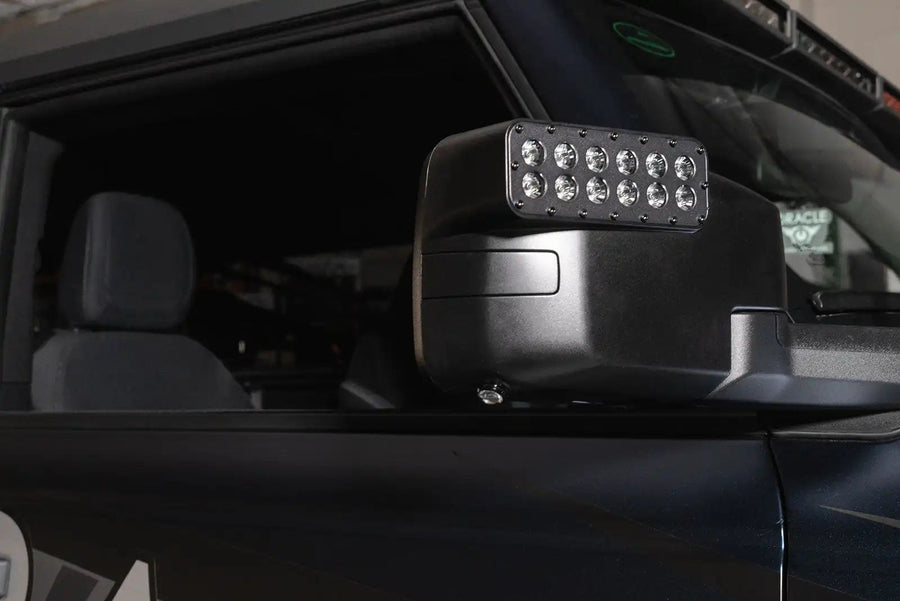 Close-up of a LED Side Mirror installed on a Ford Bronco with Puddle Light upgrade