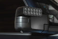 Close-up of a LED Side Mirror installed on a Ford Bronco with Puddle Light upgrade