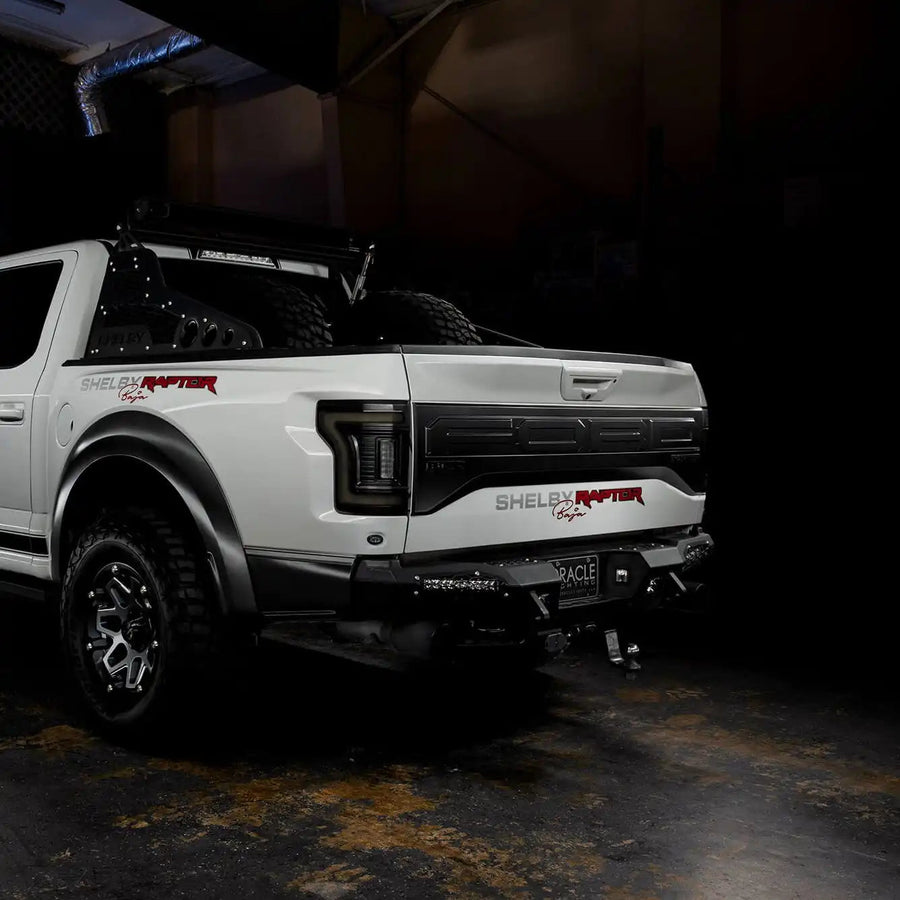 Rear three quarters view of white Ford Raptor with Tinted Flush Style LED Tail Lights installed
