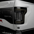 Close up of Tinted Flush Style LED Tail Lights installed on white Ford Raptor