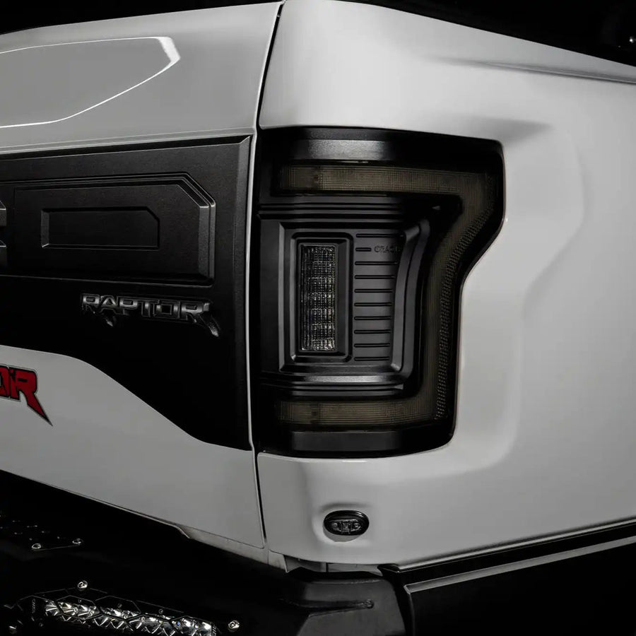 Close up of Tinted Flush Style LED Tail Lights installed on white Ford Raptor