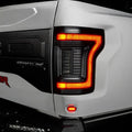 Close up of Flush Style LED Tail Lights installed on white Ford Raptor with running lights on