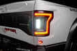 Close up of Flush Style LED Tail Lights installed on white Ford Raptor with reverse lights on