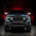 Straight front view of a RAM TRX with LED Off-Road Side Mirror Ditch Lights installed and turned on