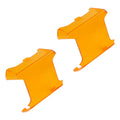 Angled view of amber VEGA Series Lens Covers