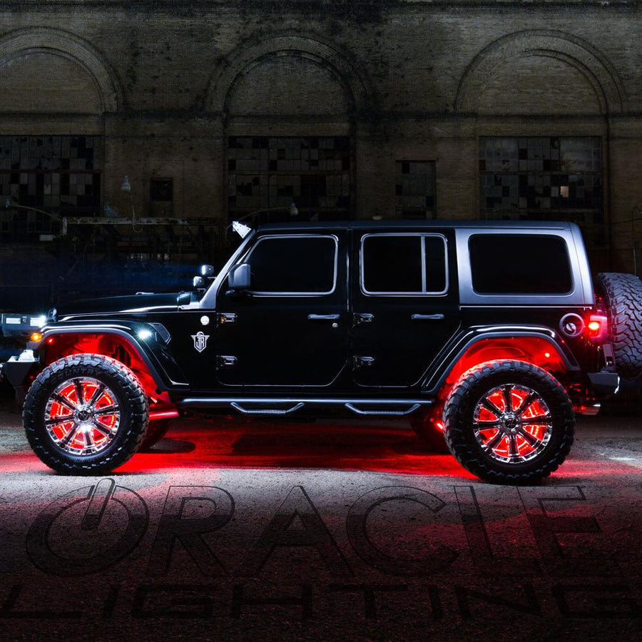 Side view of black Jeep with red LED wheel rings.