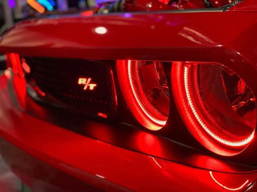 Close-up of challenger headlights with red halos
