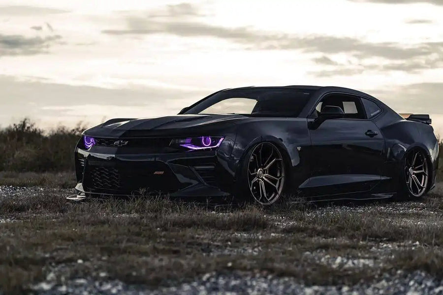 Black camaro with purple DRLs and projector halos
