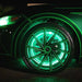 Close up of a Ford Mustang with green LED wheel rings.
