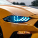 Close-up of a Ford Mustang headlight with white LEDs.