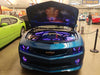 Camaro in a showroom with LED engine bay lighting.