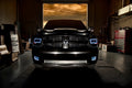 Front end of a RAM truck with Switchback Quad Pre-Assembled Halo Headlights installed and white halos on.