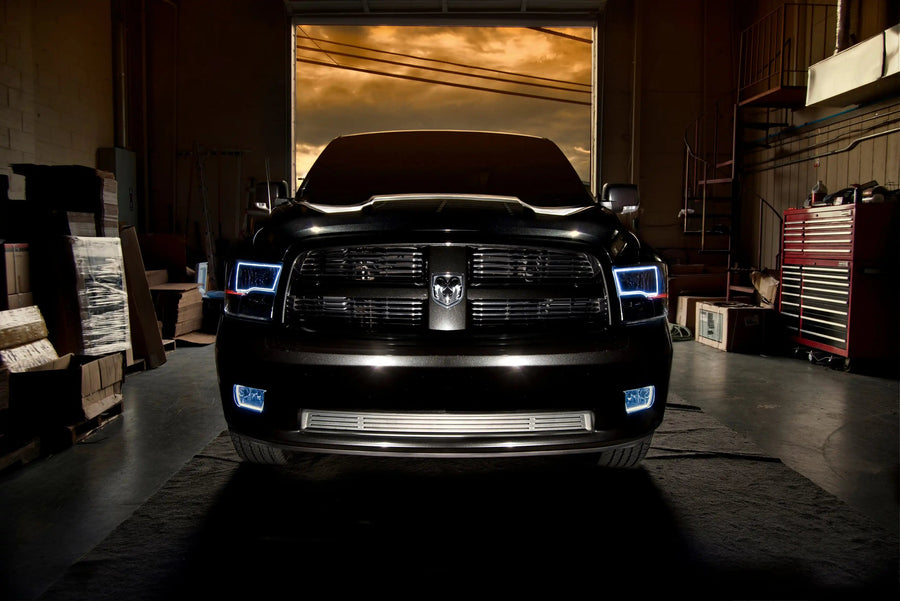 Front end of a RAM truck with Switchback Quad Pre-Assembled Halo Headlights installed and white halos on.