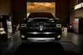 Front end of a RAM truck with Switchback Quad Pre-Assembled Halo Headlights installed and yellow halos on.