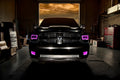 Front end of a RAM truck with Switchback Quad Pre-Assembled Halo Headlights installed and pink halos on.