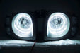 Nissan Xterra headlights with white LED halo rings.