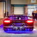Rear view of a Lamborghini with blue LED underbody kit.