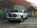 Three quarters view of a Dodge Ram with white LED headlight halo rings installed.