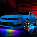Blue Camaro with rainbow LED underglow.