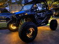 Polaris RZR with yellow LED illuminated wheel rings.