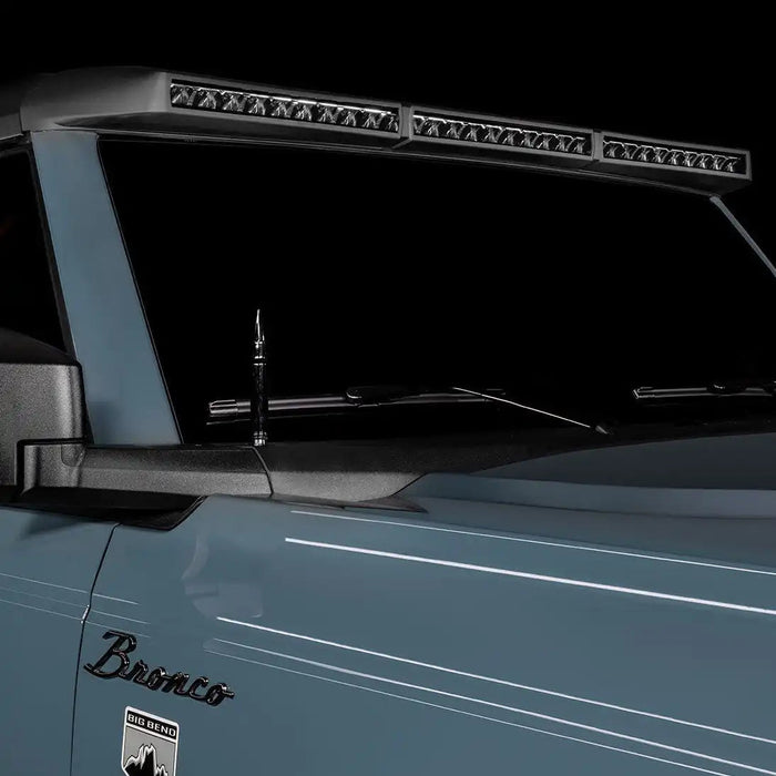 Close-up of a grey Ford Bronco with the Integrated Windshield Roof LED Light Bar System installed.