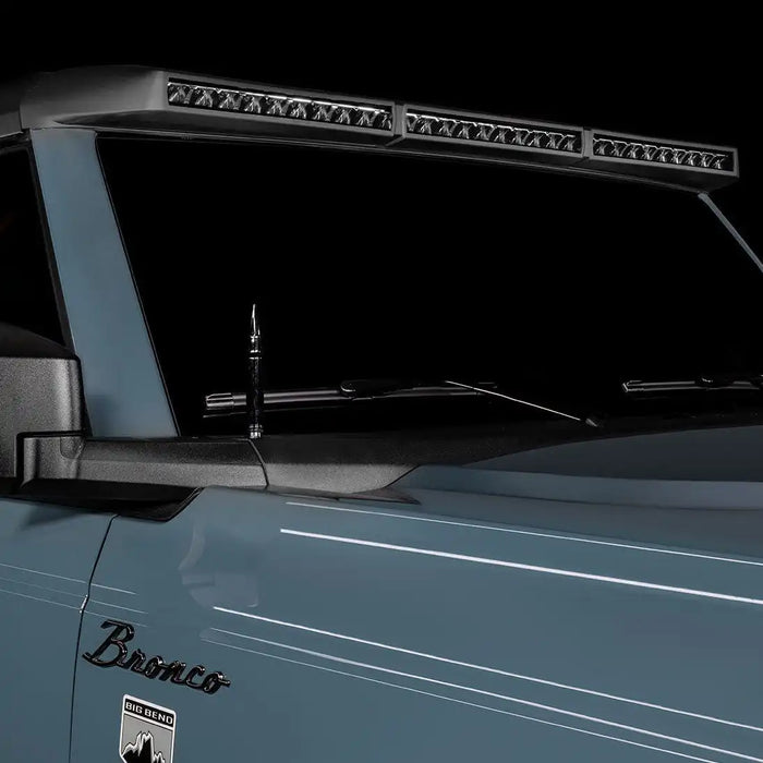Close-up of a grey Ford Bronco with the Integrated Windshield Roof LED Light Bar System installed.