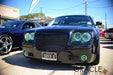 Front end of a Chrysler 300 with green LED headlight and fog light halo rings installed.