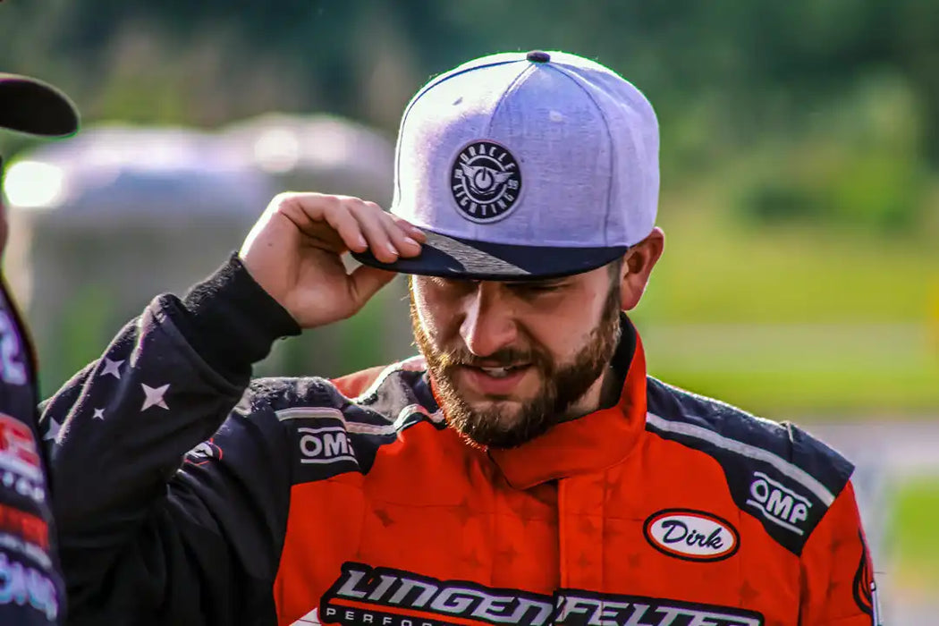 Man wearing ORACLE Lighting Official Snap-Back Hat