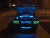 Challenger in a driveway with engine bay illuminated by LED lighting strips.