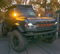 Grey Ford Bronco in a driveway with Amber LED Illuminated Letter Badges.